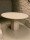Round travertine dining table